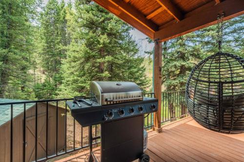 a grill on a deck with a bird cage at Aspen Haven - Mountain Retreat BBQ Scenic Views in Divide