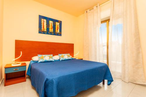 Postel nebo postele na pokoji v ubytování Chiara Home Apartment