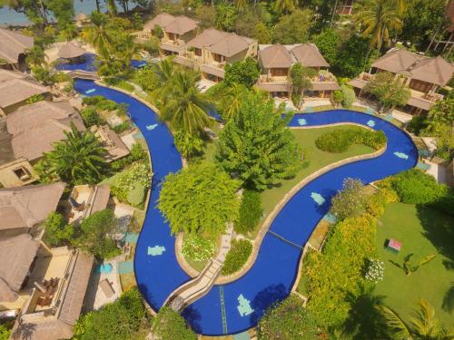 an aerial view of a resort with a river at Pool Villa Merumatta Senggigi in Senggigi