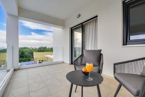 a living room with a couch and a table with a candle at Villa Insula in Linardići
