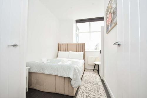 a small bedroom with a bed and a window at Modern & Compact 1 Bedroom Apartment in Bradford in Bradford