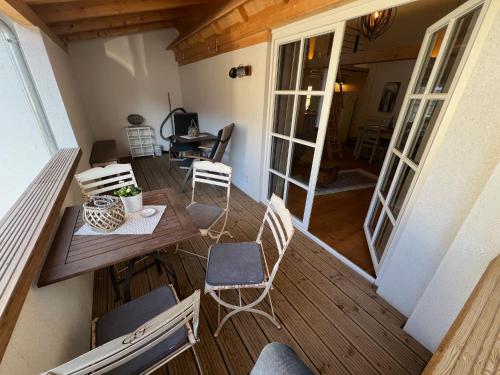 a balcony with a table and chairs on a deck at Ferienhaus Fachwerk Sanct Peter in Bad Neuenahr-Ahrweiler