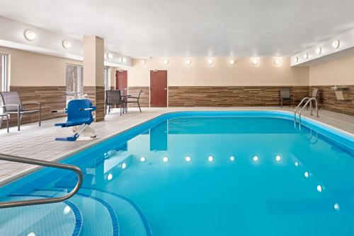 a pool in a hotel room with blue water at Fairfield Inn by Marriott Warren Niles in Warren