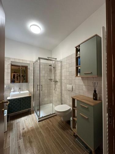 a bathroom with a shower and a toilet and a sink at Appartamento a Luino Cavallotti25 in Luino