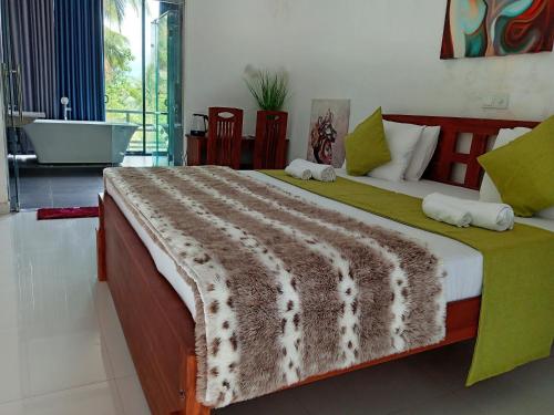 Ένα ή περισσότερα κρεβάτια σε δωμάτιο στο Pearl White Residency-VILLA