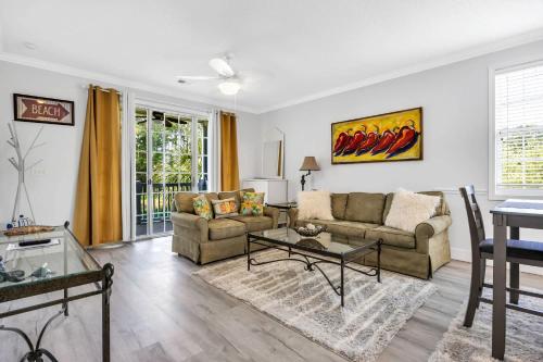 a living room with a couch and a table at Angie's Place w Golf Views Plus Huge Resort Pool in North Myrtle Beach