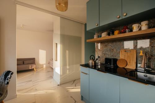 Η κουζίνα ή μικρή κουζίνα στο Apartament Miętowy