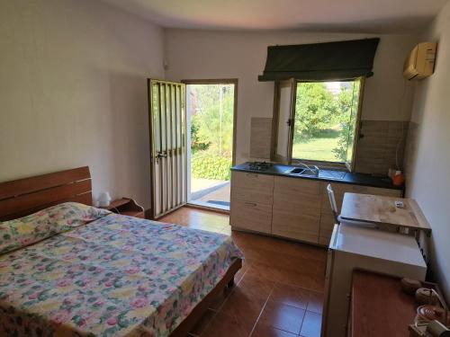 Ένα ή περισσότερα κρεβάτια σε δωμάτιο στο Villa Flori