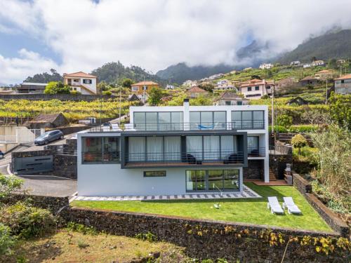 a house on a hill with a view at villa vista do vale in São Vicente