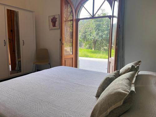 Ένα ή περισσότερα κρεβάτια σε δωμάτιο στο Agriturismo "Donna Cettina" - Suite per gli ospiti
