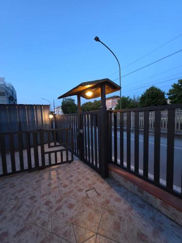 a wooden fence with a gazebo on it at B612 bed & breakfast CAMERE in Manoppello