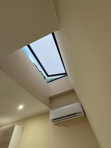 a skylight in a ceiling with a air conditioner at Palazzo Valentino in Naples