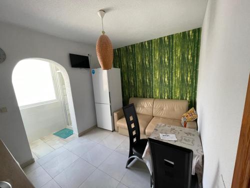 a living room with a couch and a table at INES CASA ojalá in Alicante