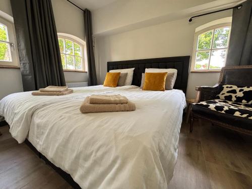 เตียงในห้องที่ Vakantiewoning Korenburgerveen 't Voorde