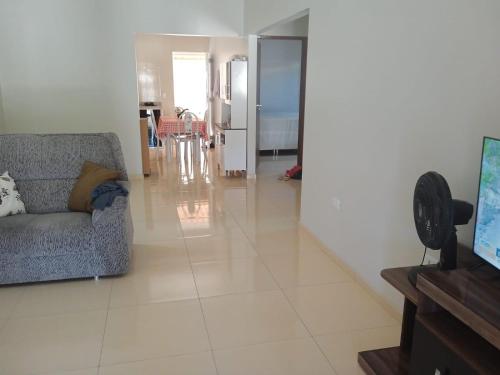 a living room with a couch and a table at Casa do Descanso in Triunfo
