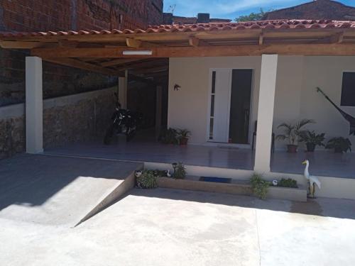 a house with a pavilion with a swan in front of it at Casa do Descanso in Triunfo