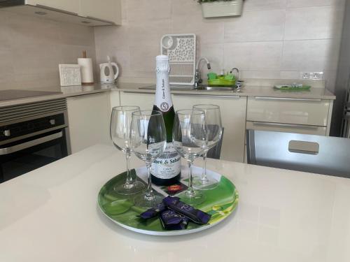 a bottle of wine and two wine glasses on a table at VILOTE Lanzarote in Tías