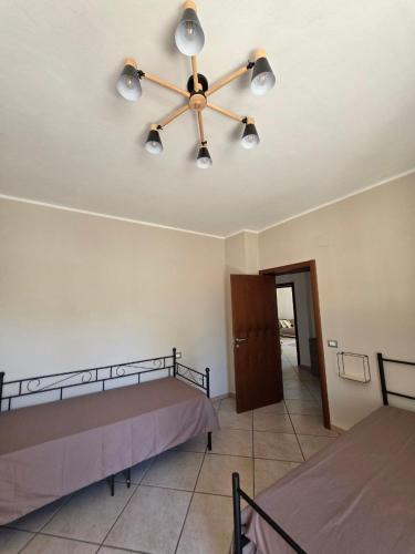 a bedroom with a bed and a ceiling fan at B612 bed & breakfast APPARTAMENTO Piccolo Principe in Manoppello