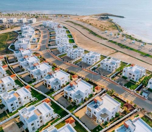 an aerial view of a city and the ocean at Fumba Uptown Ocean Front Villa in Fumba Uwandani