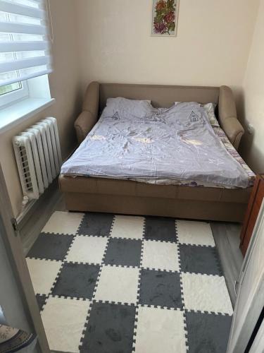 Llit o llits en una habitació de Comrat New Residence