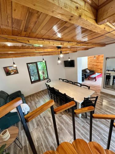 a dining room with a table and chairs at Cabana Caterina in Topliţa