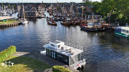 a group of boats are docked in a marina at Bed en B-ootje in Bunschoten