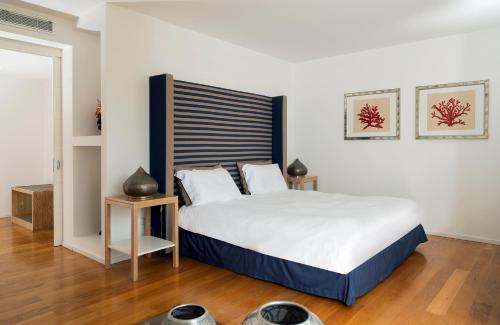 a bedroom with a large bed in a room at Relais Blu in Massa Lubrense