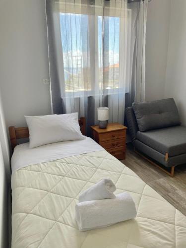 Ένα ή περισσότερα κρεβάτια σε δωμάτιο στο Room 2