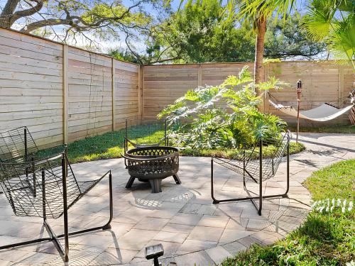 a patio with two chairs and a fire pit at Anastasia Island Villa Upper Level plus Rooftop in St. Augustine