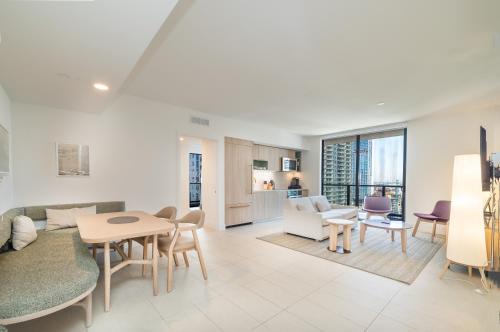 a living room with a couch and a table at Stunning 2 Bed 2 Bath w balcony & incredible views in Miami