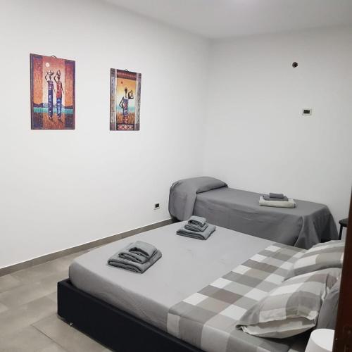 Ένα ή περισσότερα κρεβάτια σε δωμάτιο στο Casa Maria