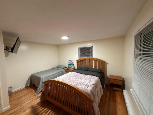 a bedroom with two beds and a window at Private Room in Melrose in Melrose
