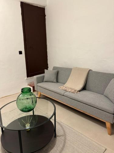 a living room with a couch and a table at Casa Les Ferreres Montblanc in Montblanc
