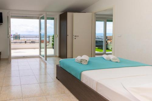 Posteľ alebo postele v izbe v ubytovaní Apartmani Dana