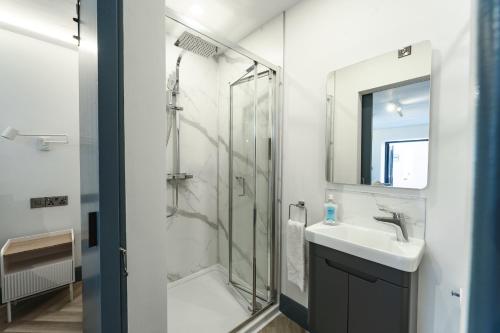 a bathroom with a shower and a sink at Luxury & Cozy Tourist Base in Bushmills