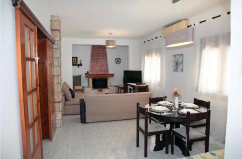 a living room with a table and a couch at Villa Tzekos in Epanomi