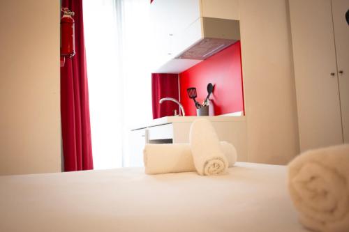 Ένα ή περισσότερα κρεβάτια σε δωμάτιο στο Citizen Suites
