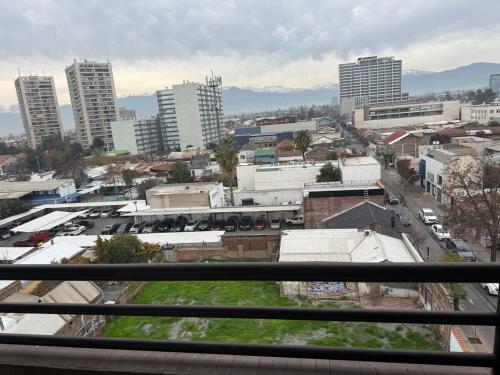 a view of a city from a balcony with buildings at Hermoso Depto Central in Rancagua