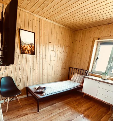Ein Bett oder Betten in einem Zimmer der Unterkunft Brzozowa Aleja