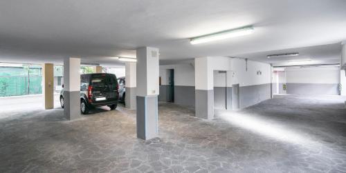 a empty parking lot with a truck parked in it at Residence Queen in Rimini