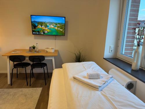 Postel nebo postele na pokoji v ubytování Urbanes Apartment Bielefeld-Bethel