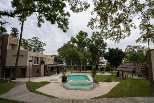 a swimming pool in the yard of a house at Complejo Turistico Open Club in Paraná