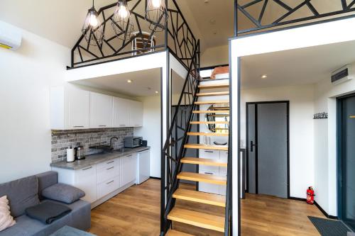 a staircase leading up to the kitchen of a loft conversion at Seaside Spokes in Wytowno