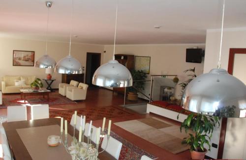a living room with domes hanging from the ceiling at Albergo della Ceramica in Villanova Mondovì