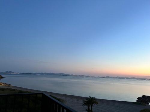 a view of a large body of water at sunset at Atardeceres & Jacuzzi in La Manga del Mar Menor