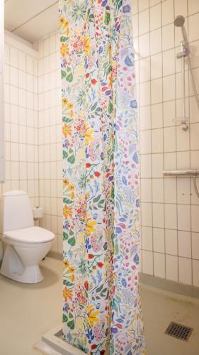 a shower curtain in a bathroom with a toilet at Morup Mølle Kro in Bedsted Thy