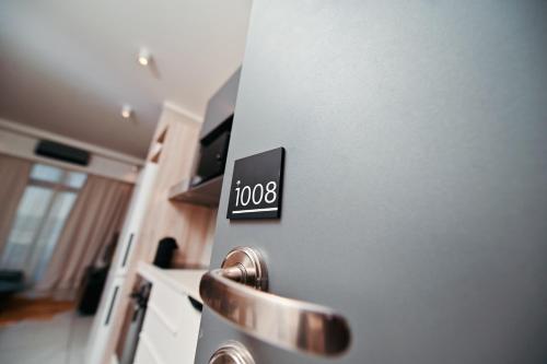 a close up of a kitchen door with a sign on it at Modern Apartment with Sunbet Casino view in Pretoria