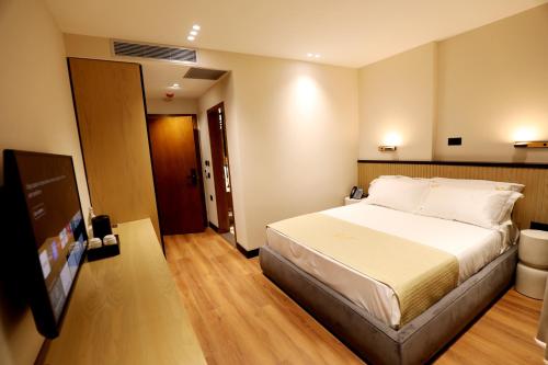 Postel nebo postele na pokoji v ubytování Rich Hotel
