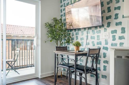 a kitchen with a table and chairs and a window at Luxe 1BR w Balcony in Downtown 542Blvd in Atlanta