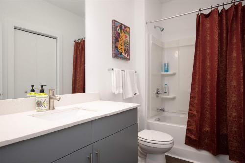 a bathroom with a sink and a toilet and a tub at Luxe 1BR w Balcony in Downtown 542Blvd in Atlanta